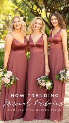 three bridesmaids in brown dresses standing next to each other