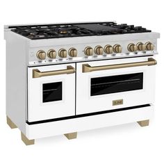 a white and gold stove with two ovens