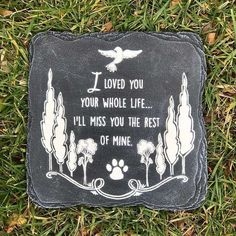 a memorial stone with the words i loved you, your whole life and an image of a dog's paw