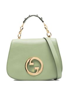 pistachio green calf leather smooth grain signature Interlocking G logo plaque signature Sylvie Web adjustable detachable shoulder strap internal logo patch gold-tone hardware stud embellishment to the handle foldover top with magnetic fastening single detachable top handle adjustable detachable shoulder strap partitioned compartment internal zip-fastening pocket leather lining This piece comes complete with a protective dust bag. Green Gucci Bag With Detachable Handle, Gucci Green Bag With Detachable Strap, Green Gucci Bag With Detachable Strap, Gucci Evening Bag With Logo Hardware, Gucci Bags With Logo Hardware For Evening, Modern Gucci Bag With Logo Hardware, Gucci Green Shoulder Bag With Detachable Strap, Chic Gucci Shoulder Bag With Metal Logo, Designer Gucci Shoulder Bag With Logo Hardware