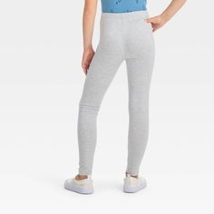 Add versatile and comfy style to her wardrobe with these Leggings from Cat & Jack. Featuring a simple fitted style that pairs perfectly with tees and shirts, she can easily wear these girls' mid-rise leggings with any top to create unique outfits. These comfy cotton-blend leggings have a hint of spandex for a comfy fit that keeps her feelin' good on her most active days. These girls' cotton leggings also have an elastic waistband to help them stay in place while she's on the go at school or whe Casual Tight Activewear Pants, Tight Casual Bottoms For Everyday, Casual Tight Pants For Everyday, Tight Casual Pants For Everyday, Trendy Stretch Cotton Leggings, Casual Gray Tight Activewear, Casual Full-length Tight Activewear, Basic Stretch Cotton Leggings, Sporty Fitted Cotton Leggings