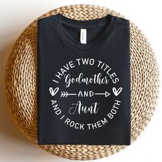 Godmother and Aunt Shirt I have two titles Godmother and Aunt Unisex Short Sleeve Tee -Christening, Announcement, Baby Reveal - Crewneck Tee This shirt is the perfect gift for your loved one or for yourself! Design is printed on your custom shirt via DTG method. NO Vinyl Check out our shops here for meaningful gifts for any special occasion. https://www.etsy.com/shop/VCApparelCreations https://www.etsy.com/shop/CustomGiftsByVC https://vcgiftstores.com SHIRT SIZING ✨ All our shirts are UNISEX T-shirts and made with the highest quality materials and are super soft and cozy!   Unisex shirts run slightly larger than women's shirts and slightly smaller than typical men's shirts. Very close to True to size. If you're looking for a more fitted look, we recommend sizing down and normal size for a Aunt Tee Shirts, Godparent Shirt Ideas, God Parents Tshirt, God Mommy Shirts, Aunt Shirts For Adults, God Mother Tshirt Ideas, Godmom Shirt Ideas, Godmother Shirt Ideas, Godmother Proposal Ideas Onesie