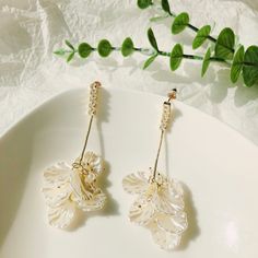 A pair of beautiful white petal flower with fresh water pearl statement fashion earrings, that give you a unique fashionable look and elevate your outfit. Add these unique Elegant statement earrings to your everyday fashion statement earrings or as gift for your love one. Made with hypoallergic materials. Silver 925 post. Take a few minutes to peruse all the gorgeous earrings at CaitlynArtStudio. See several things you like? Treat yourself and pick up a gift or two. Use code BAIXIANGGUO to recei Drop Earrings For Spring Wedding, Feminine Flower Dangle Earrings With Pearl Drop, Elegant Pearl Earrings With 3d Flowers, White Drop Flower Earrings For Party, White Flower-shaped Earrings For Party, White Flower Drop Earrings For Parties, White Flower-shaped Party Earrings, Elegant Petal Shaped 3d Flower Earrings, Feminine White Bridal Earrings For Party