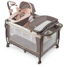 a baby crib with an infant in it