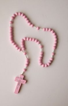 BEST WOOD / CORD ROSARY TO CARRY AROUND. NOT BIG NOT SMALL. PERFECT SIZE. COLOR: Pink SIZE/LENGTH: 11" long including the cross. CROSS: Wood 1-5/8" x 7/8" with the image of Jesus on the Cross BEADS: Made with wood.  Because of its size, this rosary CAN NOT be used as a necklace rosary. This is a very economic, good quality and elegant rosary that you can be proud to take anywhere. * LEAD FREE PAINT * Come Visit Us at Our New Store! Please feel free to email me with questions about this item. Also please check my other listings. I am always available to answer your questions promptly. Buy from us with confidence. Cheap Pink Rosary As Gift, Affordable Handmade Pink Rosary, Pink Rosary, Image Of Jesus, Cross Wood, Cross Beads, Free Paint, Jesus Images, Jesus On The Cross