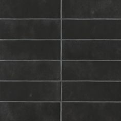 a black tile wall that is very dark