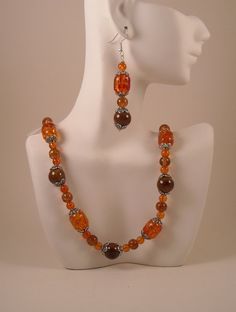 Burn Me Orange Beaded Necklace and Earrings by jewelrybypatsdesign Brown Czech Glass Jewelry With Large Beads, Brown Czech Glass Jewelry With Polished Beads, Orange Beaded Necklace, Beads Long Necklace, Porcelain Beads, Necklace And Earrings Set, Necklace And Earrings, Acrylic Beads, Black Glass