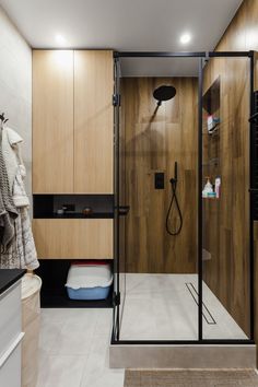 a bathroom with a walk in shower next to a sink