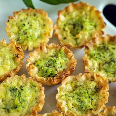 broccoli and cheese cups on a white plate