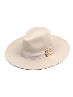 Editor's NotesThis classic fedora is made from soft wool-felt and trimmed with a traditional grosgrain ribbon with a metal logo. It has a Velcro fastening inside so easy to adjust fit.- Grosgrain ribbon and metal logo trim at the side- Adjustable inside Velcro fastening- Unisex wearMeasurements (in.) One size- Height: 5.1 in. - Brim Length: 3.5 in.- Circumference: 23.2 in.  Composition & Care- 100% Wool- Refer to the care labelDesigner- by Universal chemistry Classic Beige Fedora Felt Hat, Luxury Beige Fedora Hat, Classic Beige Wool Hat Band, Classic Wool Fedora For Spring, Elegant Beige Fedora With Flat Crown, Elegant Beige Winter Fedora, Luxury Brimmed Fedora For Fall, Elegant Beige Felt Hat For Fall, Luxury Wool Fedora With Flat Brim