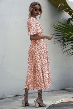 Summer Printed Maxi V-neck Dress, V-neck Floral Print Maxi Dress For Beach, Casual Pink V-neck Dress For Vacation, Spring Floral Print V-neck Dress For Vacation, V-neck Floral Print Beach Dress For Brunch, Breezy V-neck Dress For Beach Cover-up, V-neck Midi Dress For Vacation, Pink V-neck Sundress, Pink V-neck Sundress For Beach