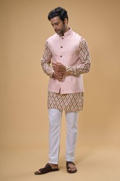 Peach sleeveless bundi crafted in cotton silk. Paired with an ikat print kurta and pant. - Aza Fashions Solid Kurta Set, Kurta Set For Men, Nehru Jackets, Ikat Print, Kurta With Pants, Band Collar, Kurta Set, Pants Pattern, Cotton Silk