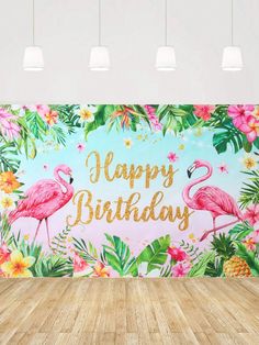 a flamingo themed birthday party backdrop with flowers and leaves