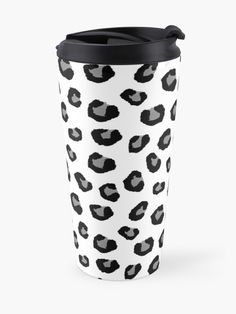 a black and white leopard print travel mug