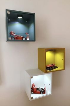 two boxes with cars in them on the wall