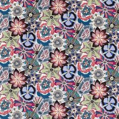 an abstract floral pattern with many colors and shapes on green, pink, blue, red,