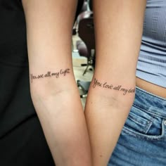 two girls with matching tattoos saying you are all my friends