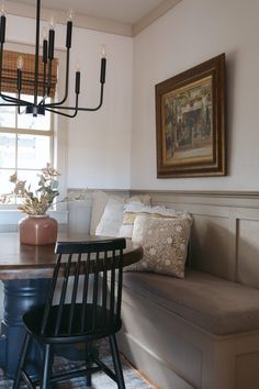 a dining room table with chairs and a bench