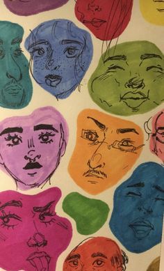 a drawing of many different faces on a piece of paper