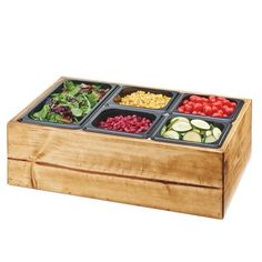 a wooden box filled with different types of salads and fruit in it's trays