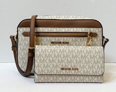 NEW WITH TAG MICHAEL KORS JET SET ITEM EAST WEST CHAIN CROSSBODY SHOULDER BAG  + TRIFOLD WALLET SET MK SIGNATURE PVC LEATHER VANILLA BROWN 100% Authentic  Retail: $348.00 Plus Tax ***Please see the Measurement for the Size*** no dust bag Zip Top Closure Michael Kors Logo At Front PVC Leather Gold Toned Hardware Custom Fabric Lining 2 Slip-in Pockets 10" (L) X 6"(H) X 2.5"(D)  Strap: 20"-23" WALLET: Gold Toned Hardware Michael Kors Logo At Front Snap Closure Zip Pocket At Back Custom Fabric Linin Michael Kors Selma Medium, Affliction Clothing, Michael Kors Satchel, Mk Handbags, Michael Kors Logo, Convertible Crossbody Bag, Mk Purse, Brown Crossbody Bag, Brown Shoulder Bag