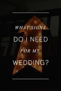 a light up arrow with the words what signs do i need for my wedding?