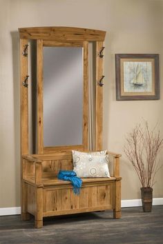 a wooden bench and mirror in a room