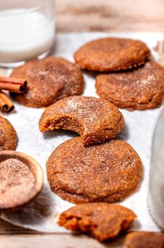 cinnamon sugar cookies and cinnamon sticks on a baking sheet