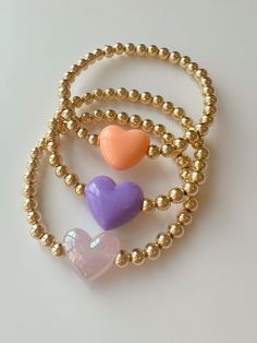 Everyday Heart-shaped Colorful Beads Jewelry, Dainty Heart Charm Bracelet With Round Beads, Dainty Heart Bracelet With Round Beads For Friendship, Heart Beads Bracelet Gift, Heart Bracelet With Round Beads For Valentine's Day, Dainty Bracelet With Heart Charm And Round Beads, Cute Gold Beaded Bracelets With Heart Beads, Everyday Heart-shaped Colorful Beaded Bracelet, Cute Bracelets With Heart Charm And Round Beads