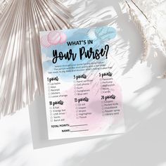 a printable what's in your purse checklist next to some palm leaves