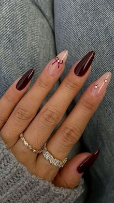 Black Fall Almond Nails, Almond Thanksgiving Nails Designs, Burgundy Nails With Flowers, November Nails Ideas Coffin, Fall Red Nails 2024, Thanksgiving Almond Nails Ideas, Almond Nails November, Purple And Brown Nails, Almond Nails Thanksgiving