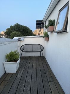 a bench sitting on top of a wooden deck