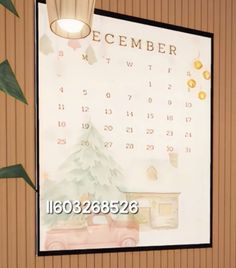 a calendar hanging on the wall in front of a plant and potted planter