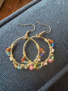 All hand made woven beaded hoop earrings gold tone Multi color glass beads Very light weight Bo Ho chic Beaded Metal Hoop Earrings, Beaded Metal Small Hoop Earrings, Metal Hoop Earrings With Colorful Beads As Gift, Small Beaded Metal Hoop Earrings, Colorful Beaded Round Metal Earrings, Small Beaded Hoop Earrings In Metal, Colorful Beaded Metal Hoop Earrings, Beaded Small Hoop Earrings In Metal, Small Hoop Beaded Metal Earrings