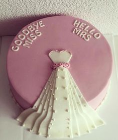 there is a cake shaped like a wedding dress on the table with words goodbye miss