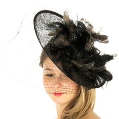 Veil Feathers Fascinator Gorgeous Feather Fascinator With Feathers And Netting That Slightly Covers The Face Weight 2.0 Oz. Material 100% Sinamay Black Short Brim Headpiece For Spring, Black Headpieces For Spring Races, Black Headpieces For Races In Spring, Winter Wedding Black Fascinator, Black Winter Wedding Fascinator, Winter Party Hats With Feathers, Elegant Black Top Hat For Fall, Fitted Black Fascinator With Feather Trim, Black Feather Trim Hat For Kentucky Derby