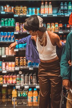 two people standing in front of a store display