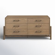 a wooden dresser with four drawers on one side and two handles on the other end