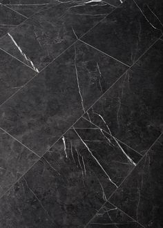 black and white marble flooring with diagonal lines in the center, as well as an arrow