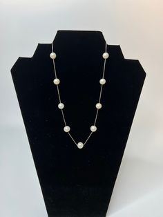 "Here we have a lovely station necklace made from silver and pearls. Standard spring-ring clasp is marked, \"925 IPS\".  925 means that the box chain is made from 925 Sterling Silver. IPS means \"Imperial Pearl Syndicate\" which is a very fine pearl jeweler. The chain is super fine and delicate. Pearls are very nicely shaped - round and consistent. Total of nine (9) pearls are staggered on the silver chain.  Original purchase price was $300.00.  Dimensions: Length: 42cm Diameter (pearls): 1cm Co Classic Sterling Silver Single Strand Pearl Necklace, Classic Single Strand Sterling Silver Pearl Necklace, Classic Silver Jewelry With Pearl Chain, Formal Single Strand Sterling Silver Pearl Necklace, Anniversary Pearl Necklace With Sterling Silver Clasp, Pearl Jewelry With Silver Chain As A Gift, Pearl Jewels, Silver Box, Station Necklace