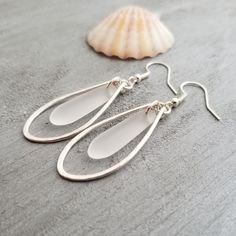 "Aloha! These design shows my love for this beautiful island of Hawaii. This item will be made to order and shipped directly from Hawaii. This is sea glass earrings with silver hooks. This handmade in Hawaii jewelry gift is from cultured sea glass that are specially formed into its shape for jewelry making. Each comes with a gift box with \"handmade by yinahawaii\" stamp and a ribbon wrapped as shown in the 2nd photo, ready to give as gift. I also offer Free gift messaging with the order. Please Minimalist Nickel-free Sea Glass Jewelry, Nickel-free Teardrop Recycled Glass Jewelry, Minimalist Nickel Free Sea Glass Jewelry, Silver Teardrop Sea Glass Jewelry, White Recycled Glass Jewelry For The Beach, Clear Sea Glass Jewelry For Gifts, Handmade White Sea Glass Jewelry, Clear Sea Glass Jewelry For Gift, Clear Sea Glass Jewelry Gift