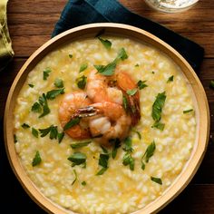 a bowl of riso with shrimp and garnish