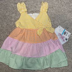 Brand New With Tags Bonnie Baby Size 6-9 Months Gorgeous Plaid Multicolored Sun Dress With Matching Diaper Cover. Retail- $48 Yellow Short Sleeve Dress For Playdate, Yellow Sleeveless Dress For Playdate, Casual Yellow Dress For Playtime, Sleeveless Yellow Dress For Playdate, Yellow Sundress For Spring Playtime, Yellow Sleeveless Sundress For Playtime, Baby Purple Dress, Yellow Cotton Sundress For Playtime, Holiday Party Dresses Christmas