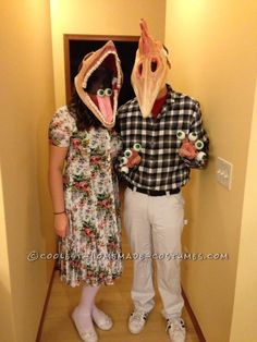 two people in costumes standing next to each other with mouths open and one person wearing an animal mask