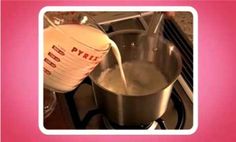 milk being poured into a pot on the stove