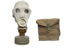 an old gas mask with a bag next to it