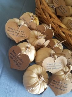 small pumpkins with heart shaped tags attached to them