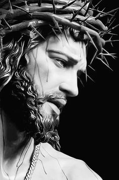 a black and white photo of jesus wearing a crown of thorns