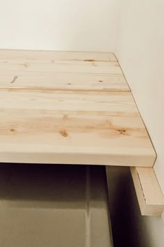 a close up of a wooden table with no one on it in the room or someone else