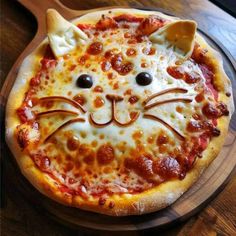 a pizza with a cat face on it